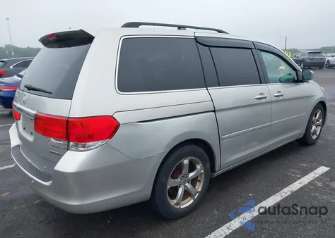 2009 Honda Odyssey Touring z USA, uszkodzony, nr VIN 5FNRL38859B029714